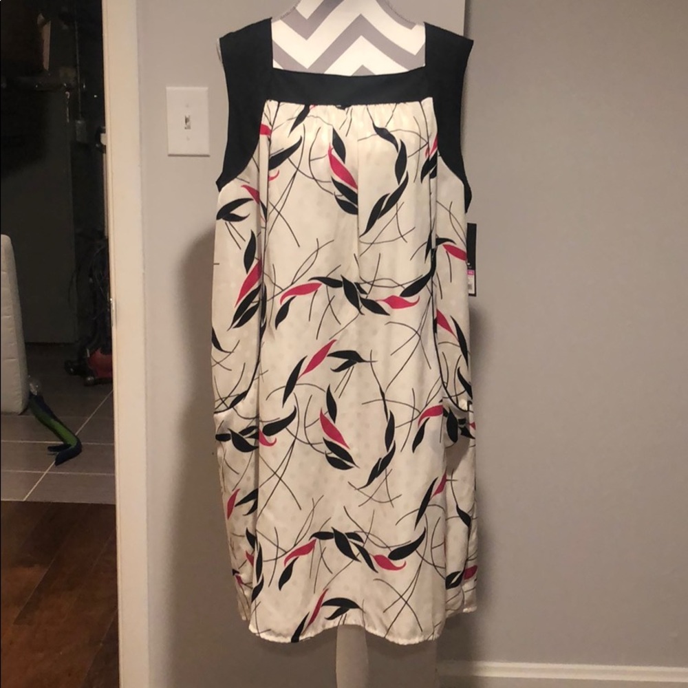 Cream, pink, and black colored dress